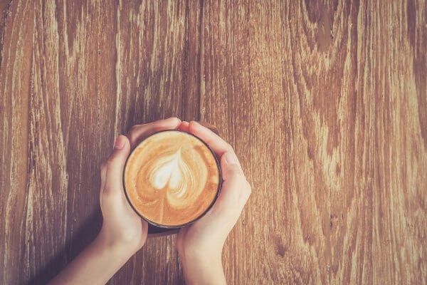 cup of coffee in coffee shop vintage color tone