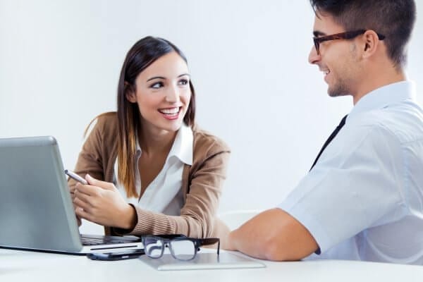 Portrait of confident business people at office desk
